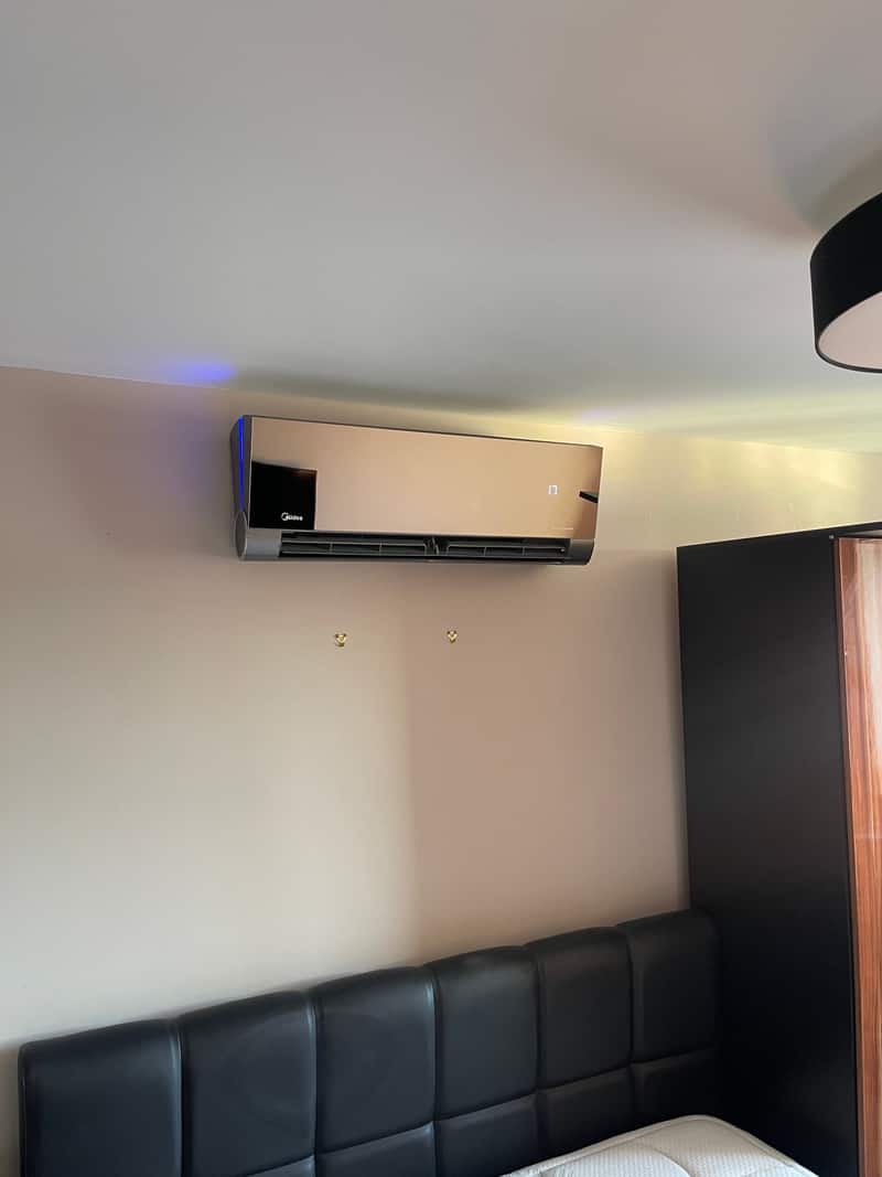 Mirror-finish designer air conditioner in a bedroom in Newcastle upon Tyne