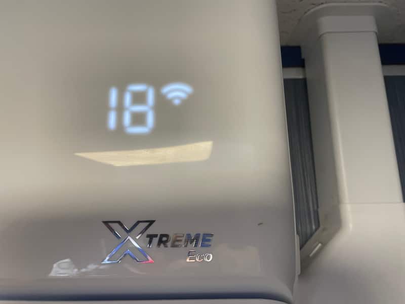 Smart air conditioner display showing 18 degrees after commissioning in Newcastle upon Tyne