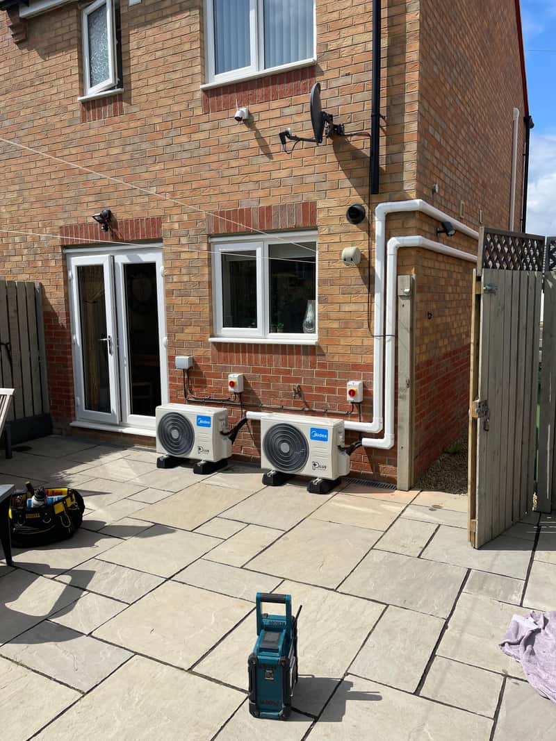 Twin outdoor air conditioning units on a family home in Newcastle upon Tyne